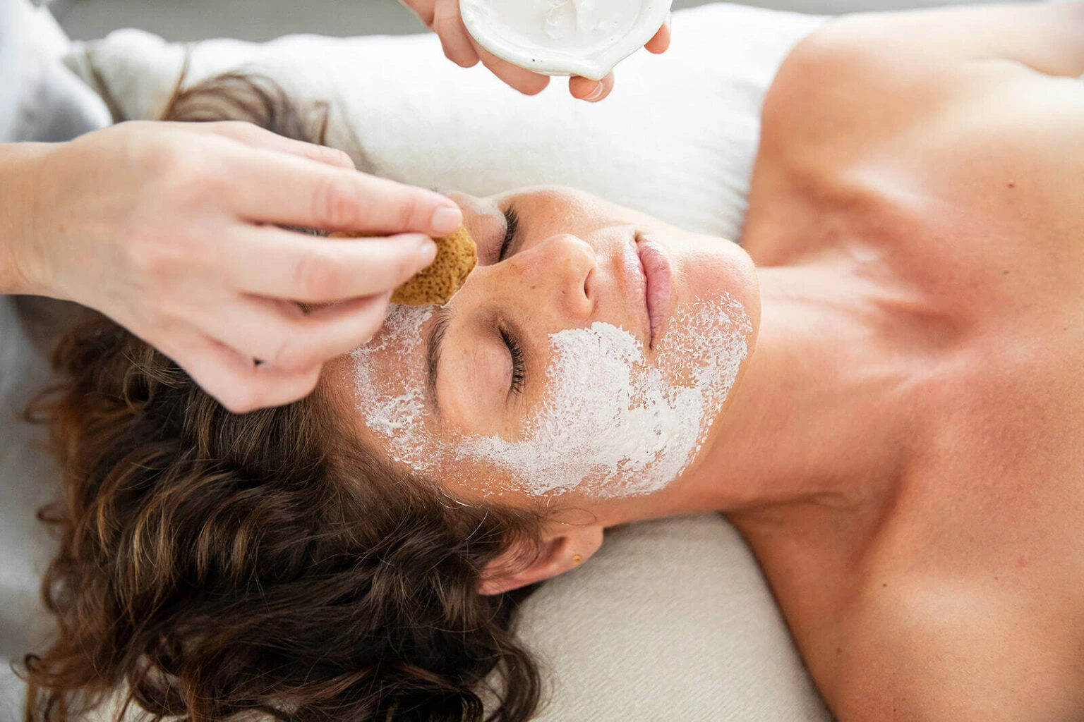 A-woman-who-does-natural-menopause-treatments-enjoying-a-treatment-1536x1024